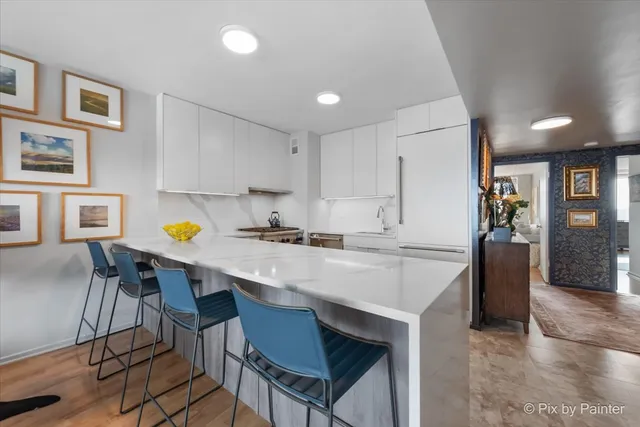 a kitchen with a table and chairs