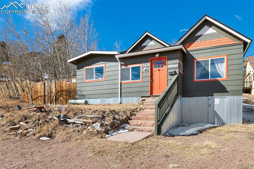 123 7th Street Victor, CO 80860 - Photo 1 of 44 a front view of a house with a yard