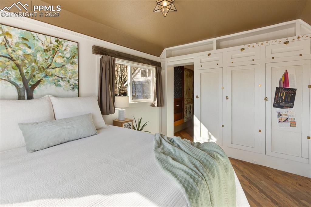 123 7th Street Victor, CO 80860 - Photo 19 of 44 a spacious bedroom with a large bed and a couch