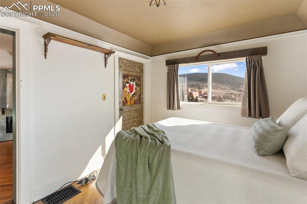 123 7th Street Victor, CO 80860 - Photo 20 of 44 a bedroom with a bed and a window