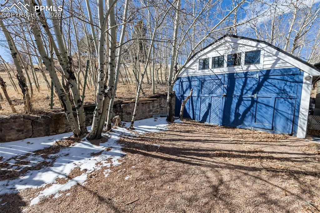 123 7th Street Victor, CO 80860 - Photo 2 of 44 a view of a wooden house with a large trees
