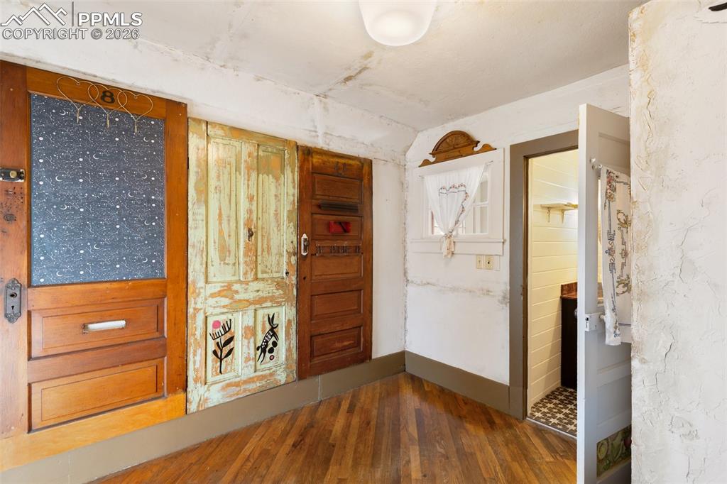 123 7th Street Victor, CO 80860 - Photo 21 of 44 a view of a hallway with wooden floor