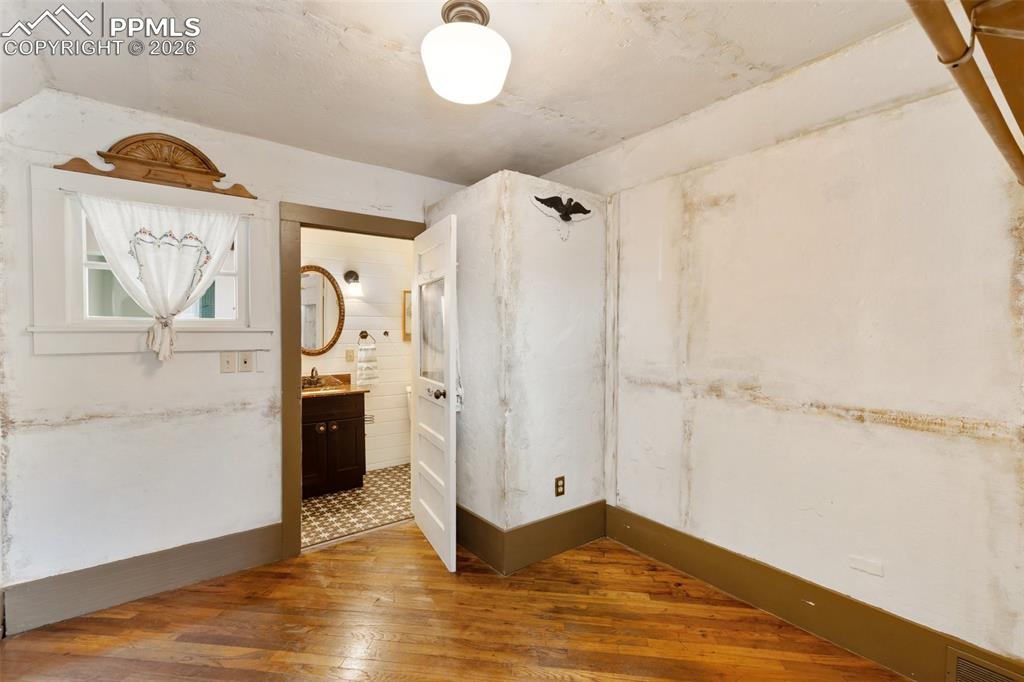 123 7th Street Victor, CO 80860 - Photo 22 of 44 a view of a room with wooden floor and cabinet