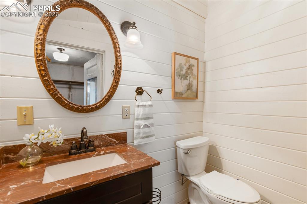 123 7th Street Victor, CO 80860 - Photo 23 of 44 a bathroom with a sink and a mirror
