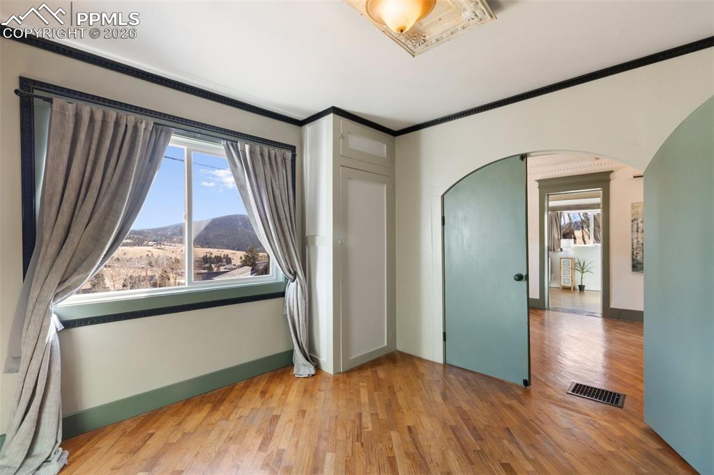123 7th Street Victor, CO 80860 - Photo 24 of 44 an empty room with wooden floor and a window
