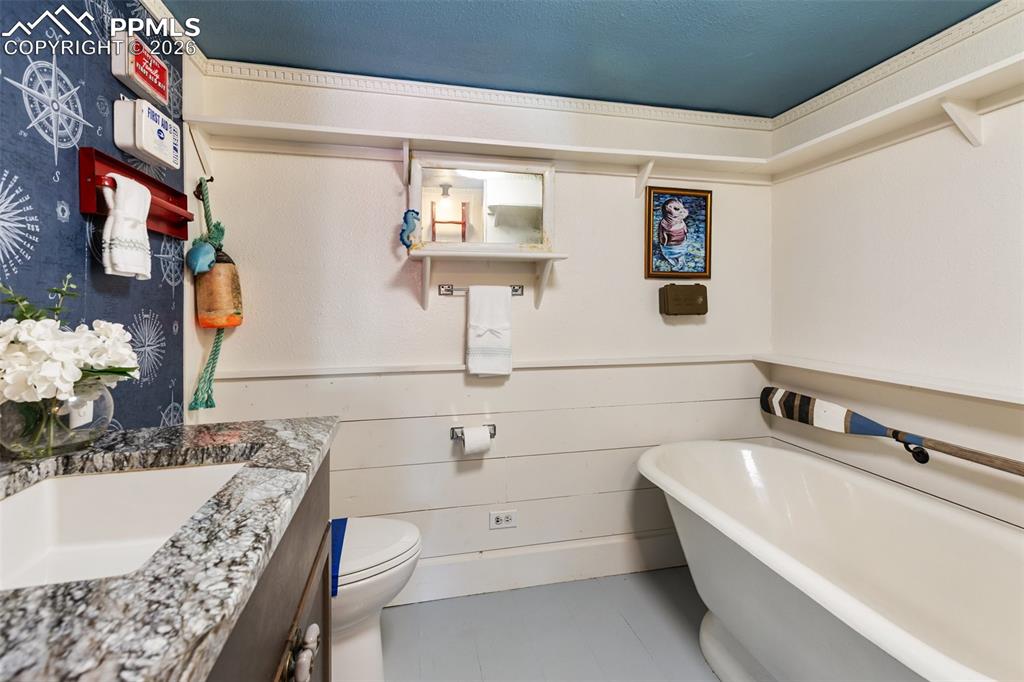 123 7th Street Victor, CO 80860 - Photo 33 of 44 a bathroom with a bathtub and a sink