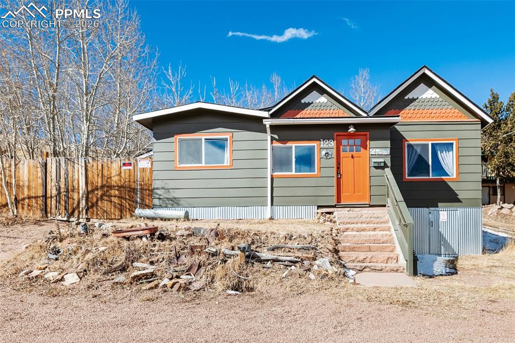 123 7th Street Victor, CO 80860 - Photo 42 of 44 a front view of a house with yard