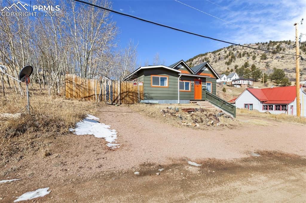 123 7th Street Victor, CO 80860 - Photo 43 of 44 a view of a large house with a yard