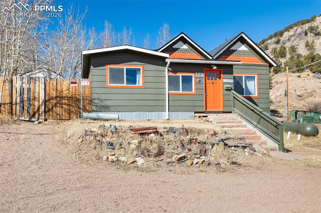 123 7th Street Victor, CO 80860 - Photo 44 of 44 a front view of a house with a yard