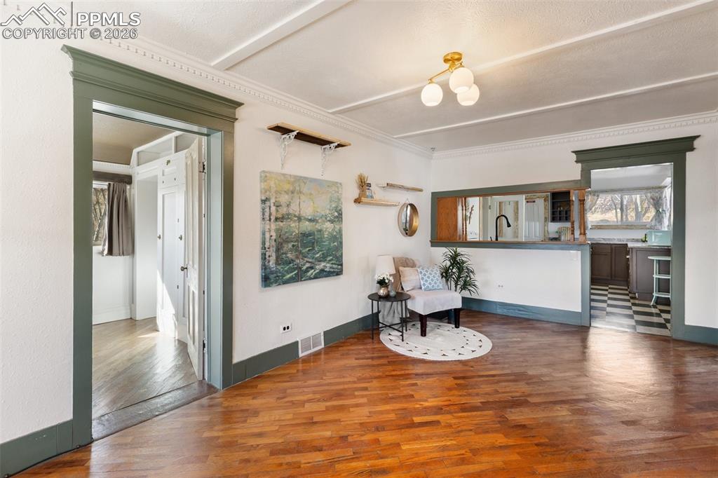123 7th Street Victor, CO 80860 - Photo 10 of 44 a living room with furniture and a chandelier