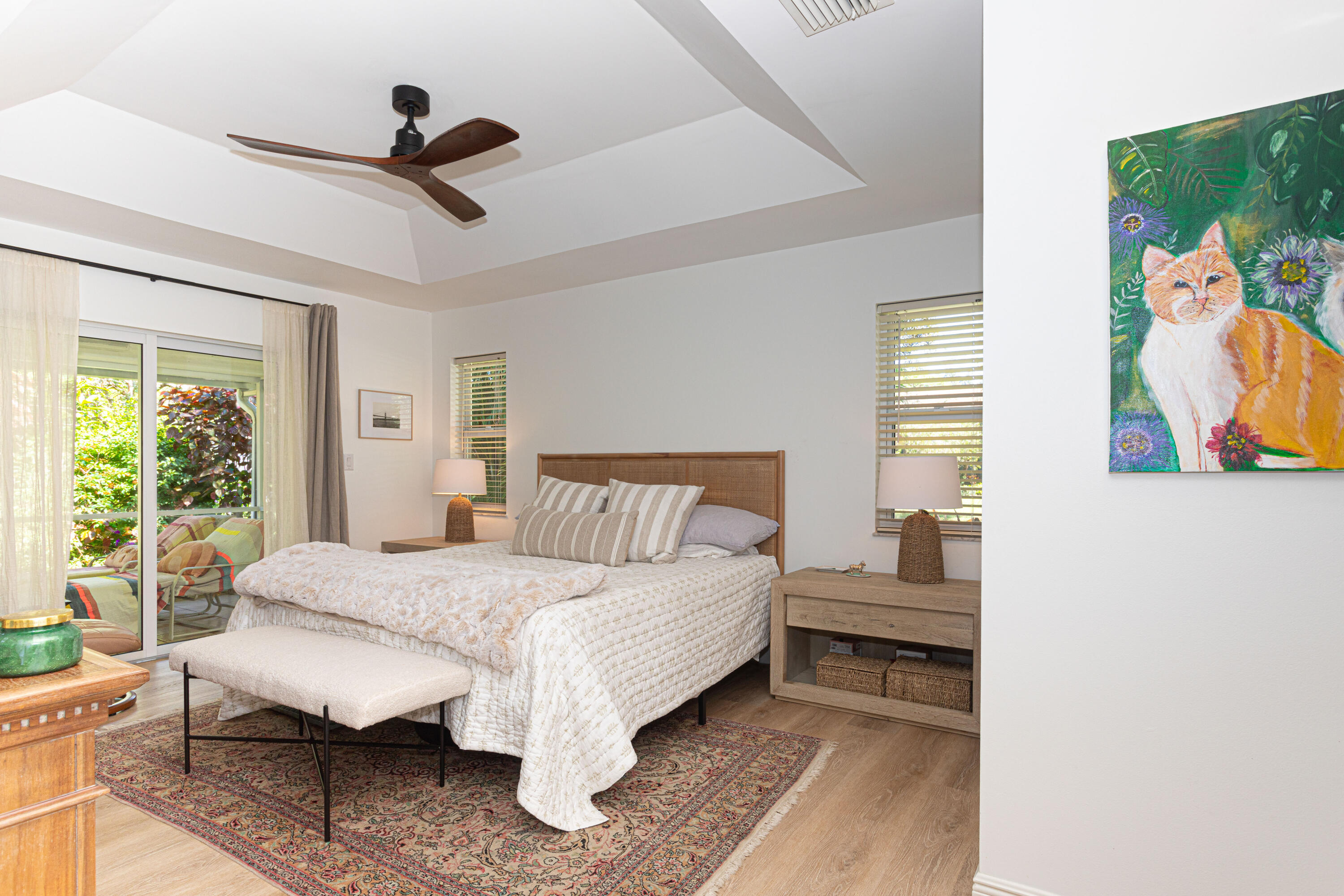 2477 Par Circle Delray Beach, FL 33445 - Photo 16 of 34 a bedroom with a bed and a painting on the wall