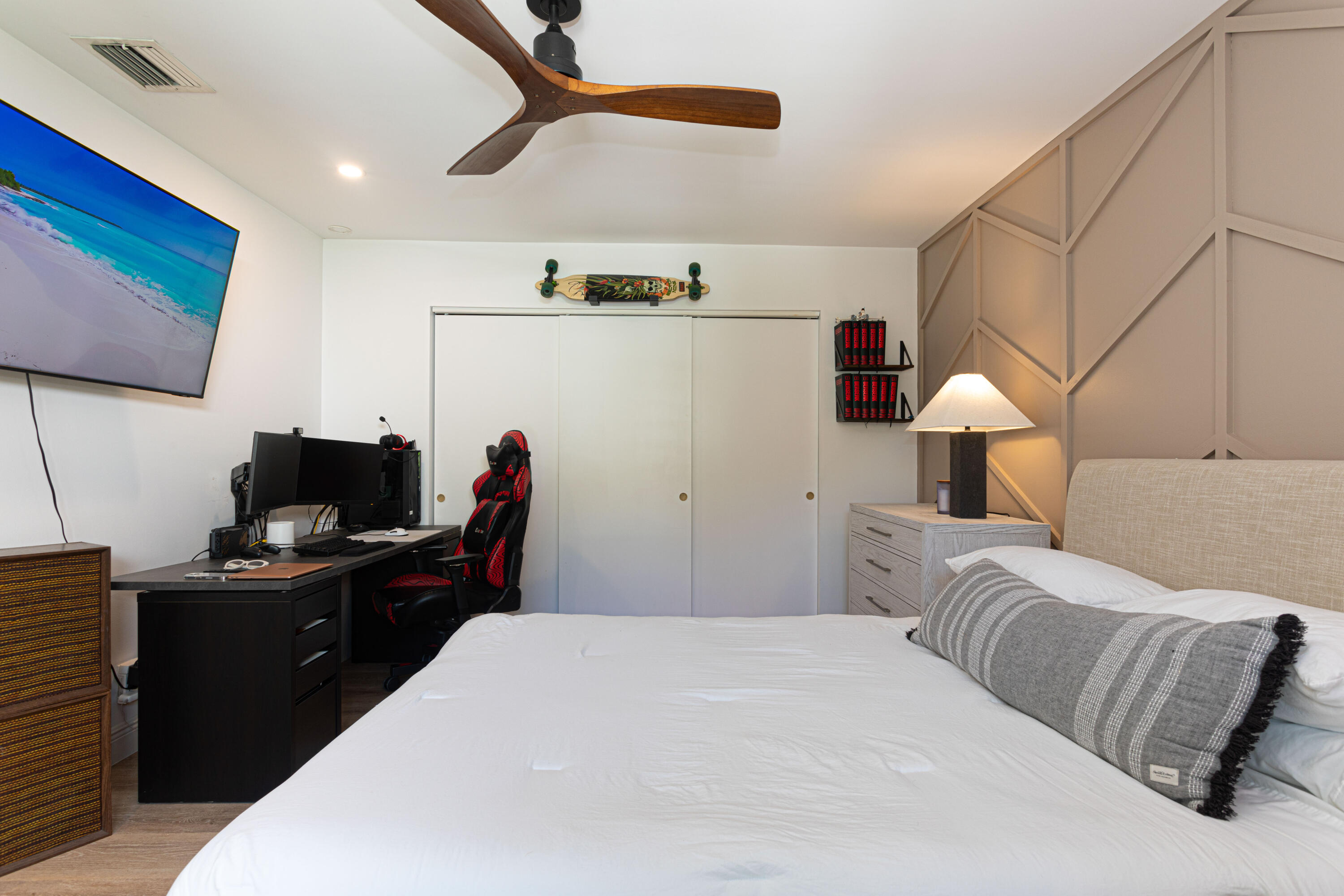 2477 Par Circle Delray Beach, FL 33445 - Photo 24 of 34 a bedroom with a bed and a flat screen tv