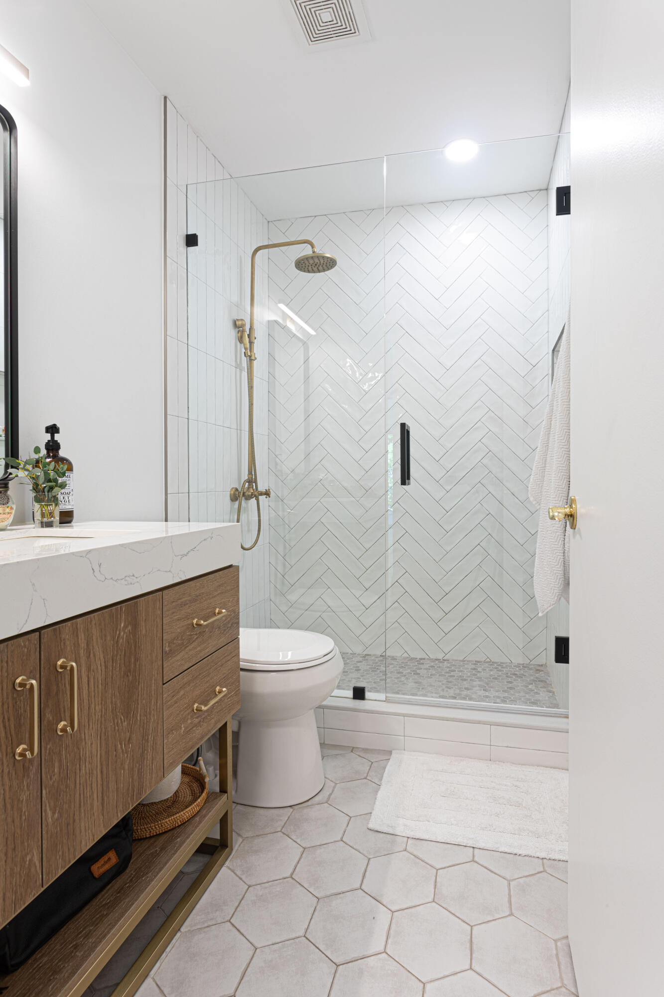 2477 Par Circle Delray Beach, FL 33445 - Photo 25 of 34 a bathroom with a sink a toilet and shower