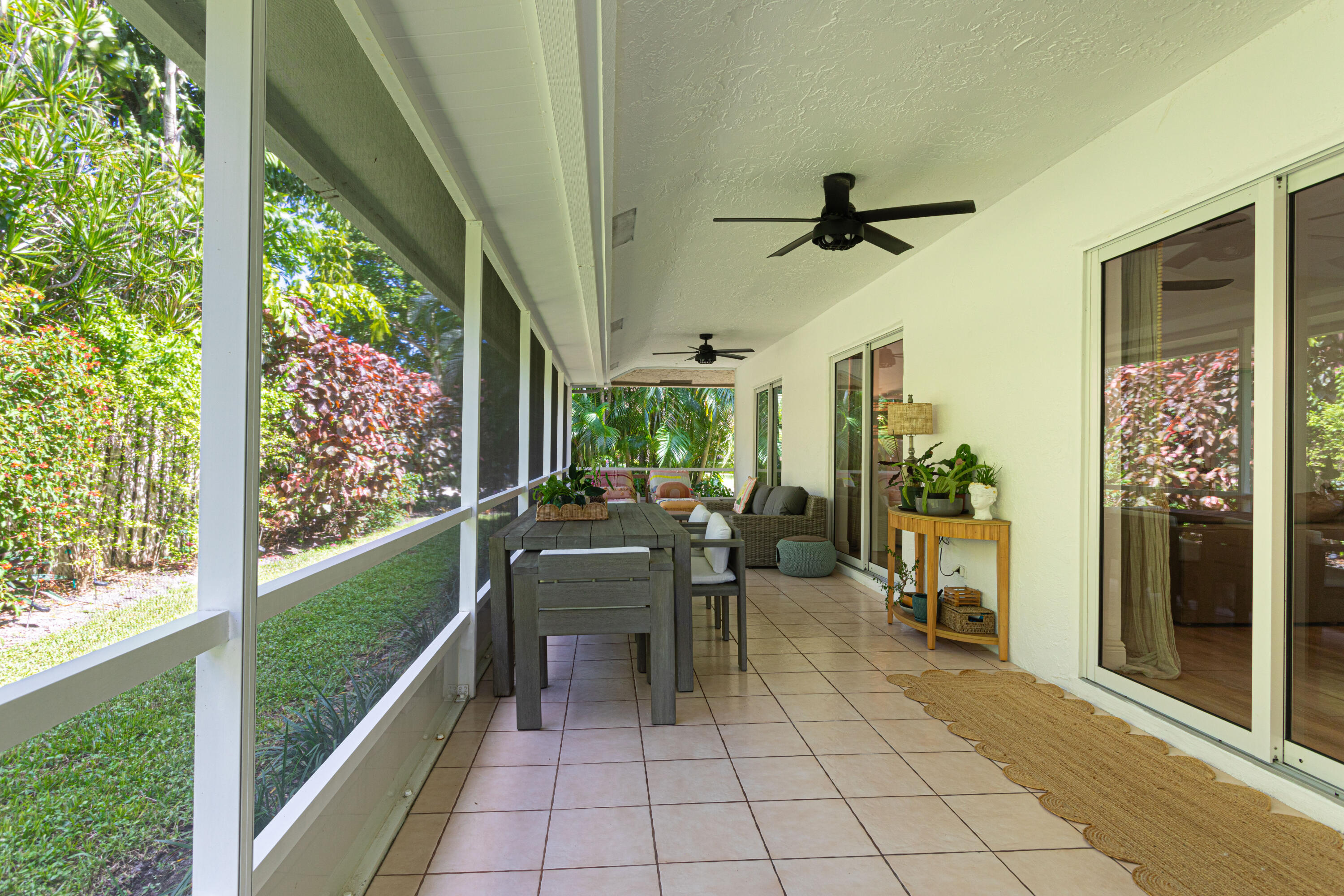 2477 Par Circle Delray Beach, FL 33445 - Photo 29 of 34 a view of a porch with chairs and backyard