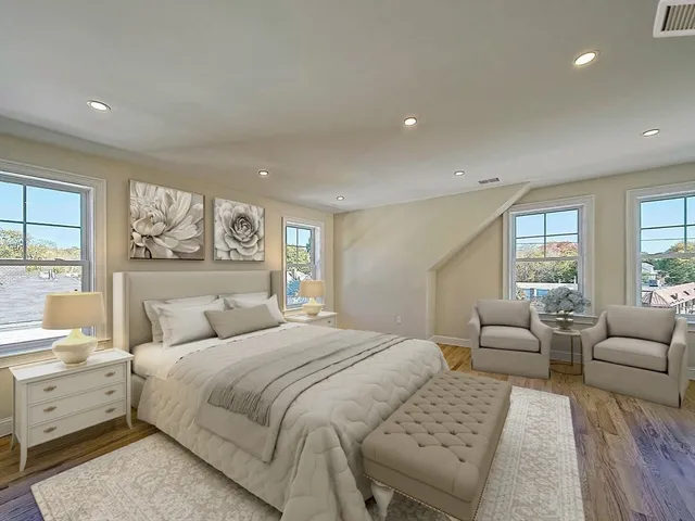 a bedroom with a large bed and a couch