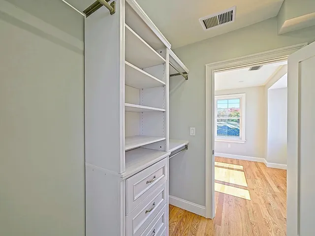 a view of an empty walk in closet