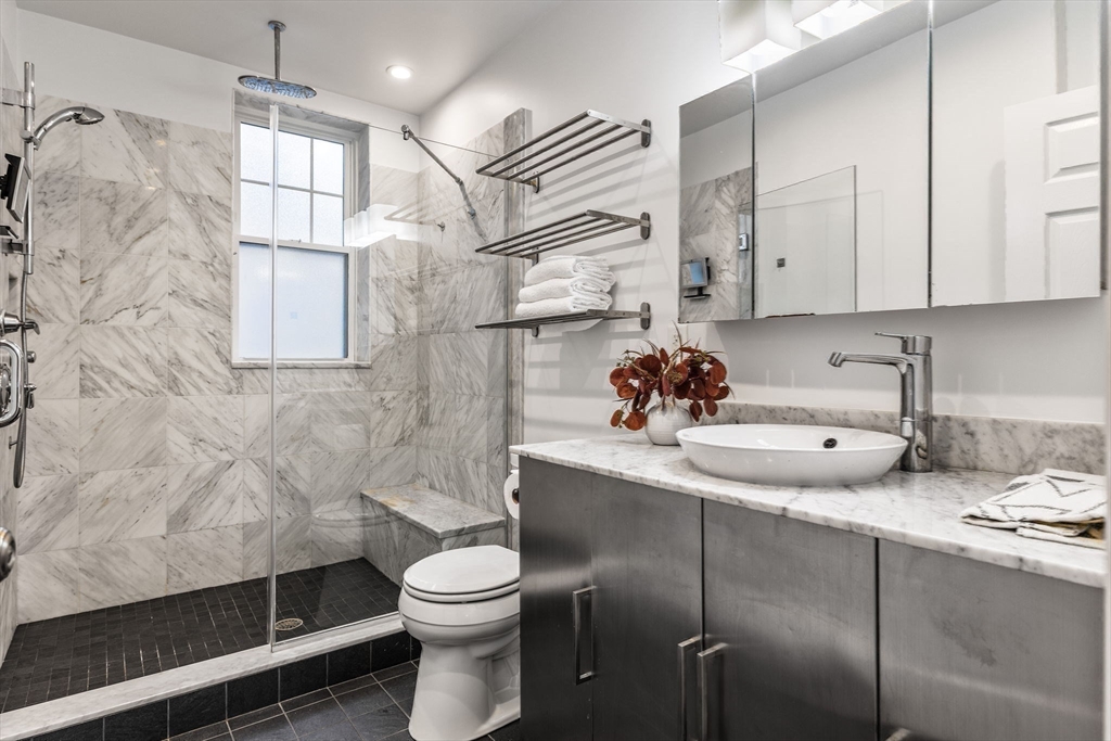 151 Longwood Avenue, Unit 1 Brookline, MA 02446 - Photo 17 of 34 a bathroom with a sink toilet and shower