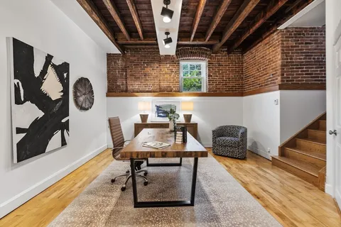 a workspace with furniture and window