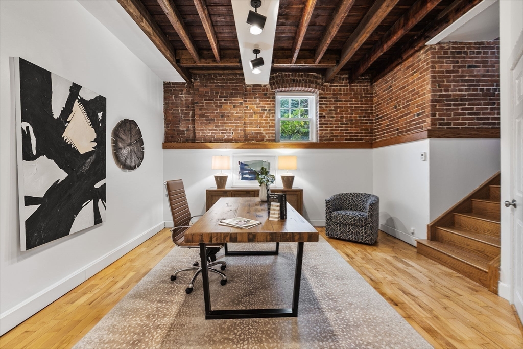 151 Longwood Avenue, Unit 1 Brookline, MA 02446 - Photo 18 of 34 a workspace with furniture and window