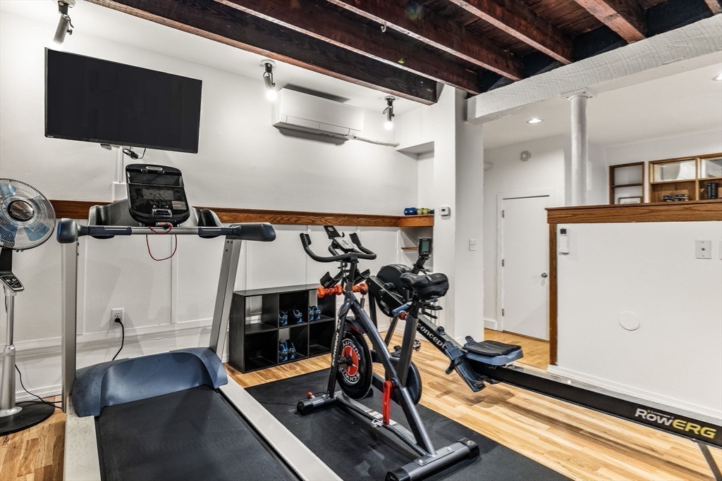 151 Longwood Avenue, Unit 1 Brookline, MA 02446 - Photo 22 of 34 a view of a room with gym equipment