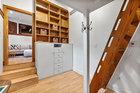 a view of bedroom with furniture and window