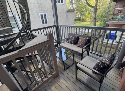 a view of a chairs on the roof deck