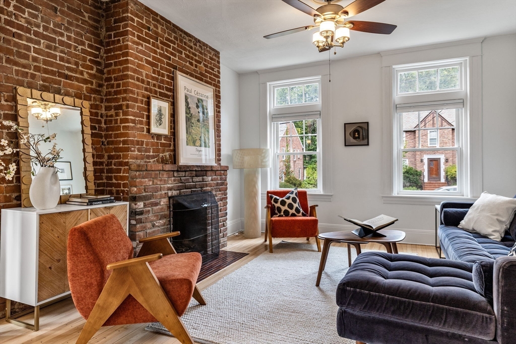 151 Longwood Avenue, Unit 1 Brookline, MA 02446 - Photo 5 of 34 a living room with furniture and a fireplace