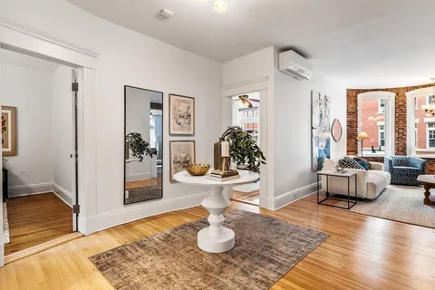 a living room with furniture and a rug