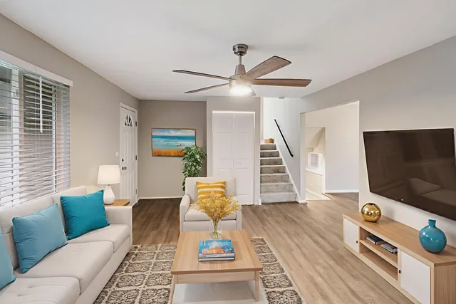 a living room with furniture and a flat screen tv