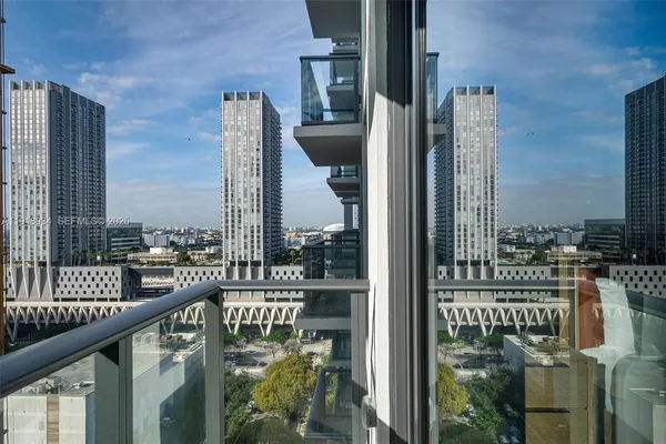 a city view from a balcony with wooden floor