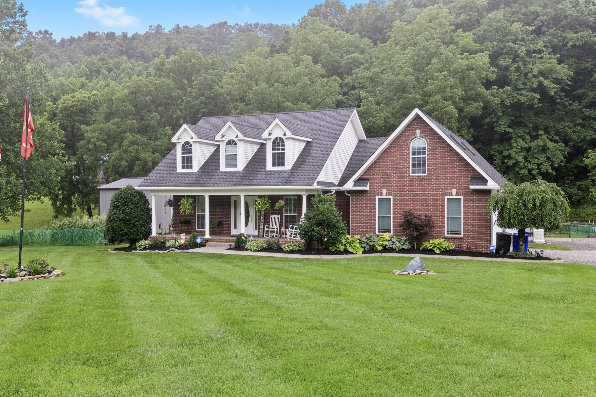 a front view of a house with garden