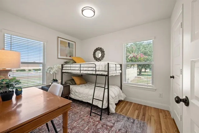 a bedroom with furniture and a window