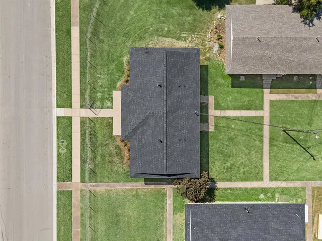 an aerial view of a house having yard