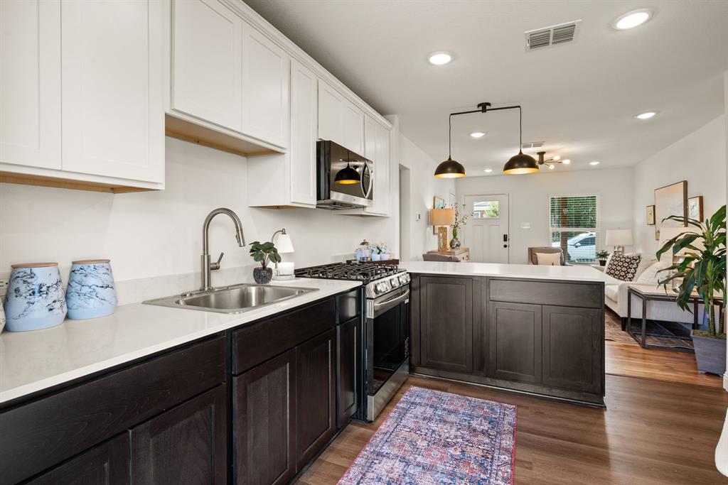 4092 Merida Avenue Fort Worth, TX 76110 - Photo 9 of 19 Spray nozzle at sink; Designer Lighting