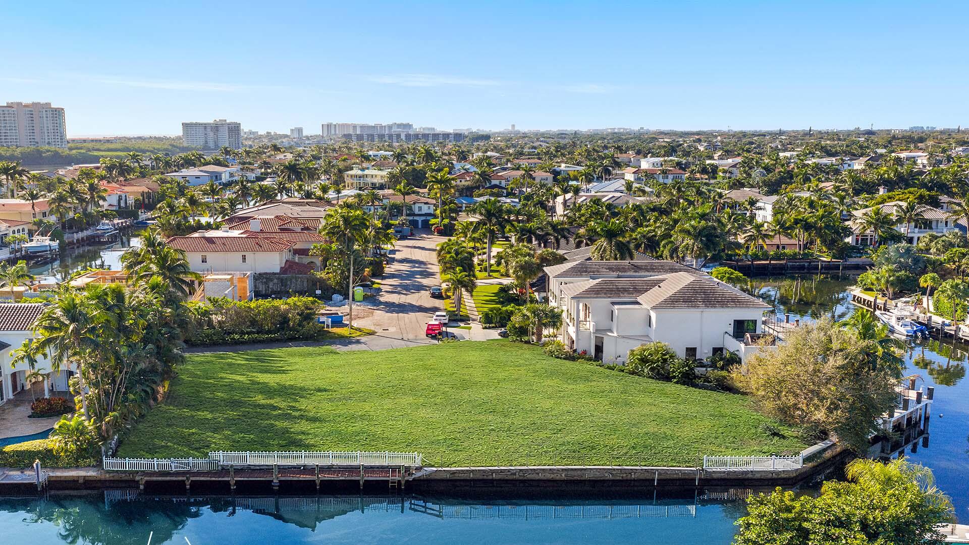 7401 Northeast Bay Cove Court Boca Raton, FL 33487 - Photo 12 of 13 an aerial view of residential houses with outdoor space and trees