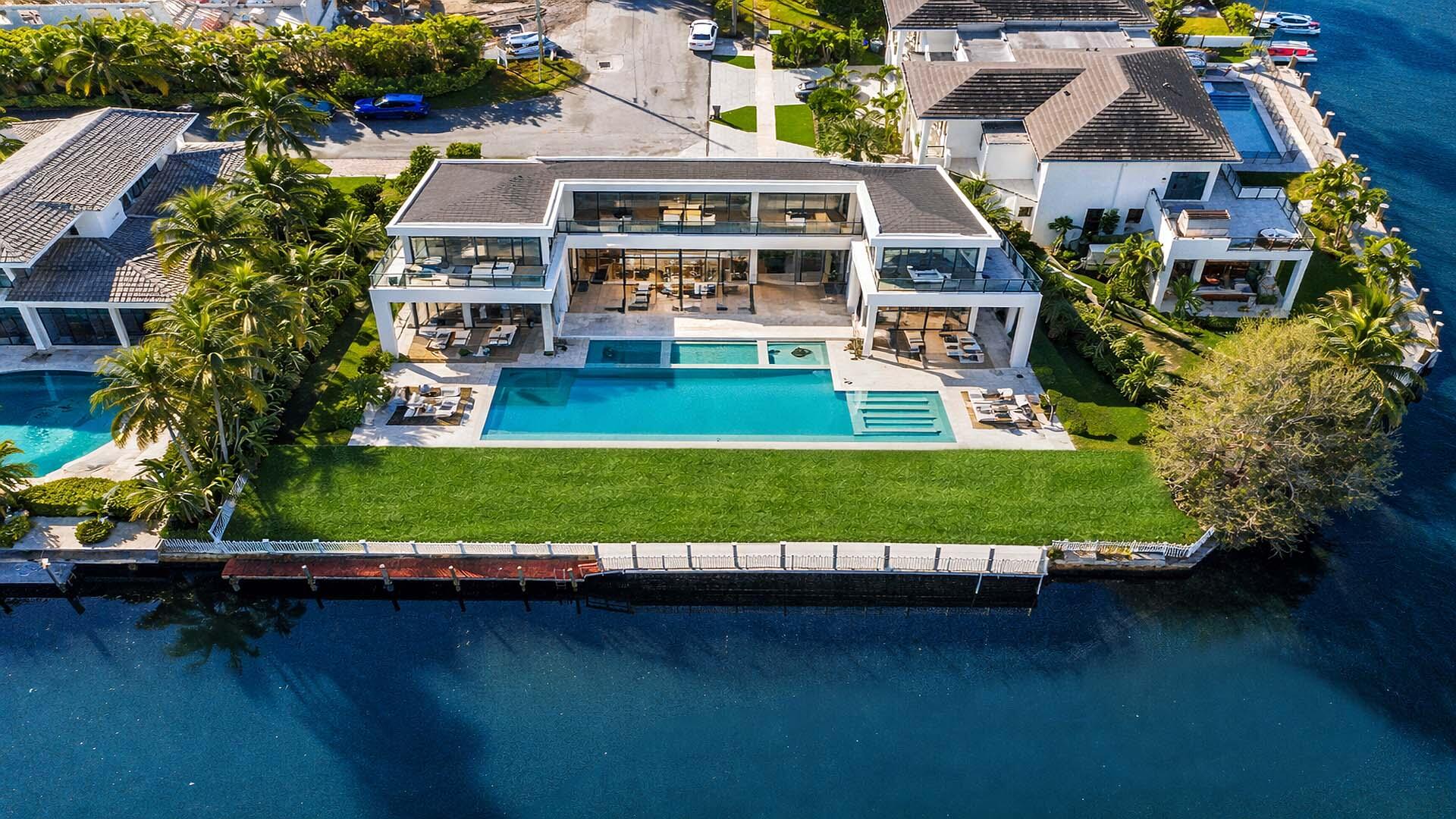 7401 Northeast Bay Cove Court Boca Raton, FL 33487 - Photo 2 of 13 an aerial view of house with yard swimming pool and outdoor seating