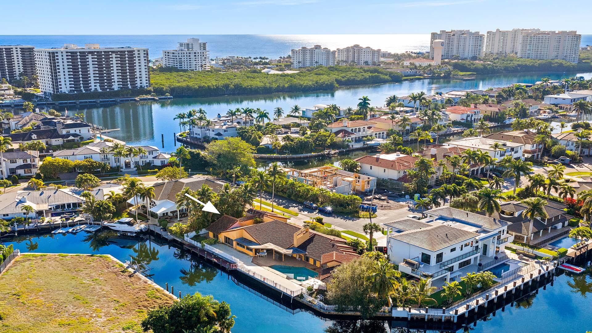 7401 Northeast Bay Cove Court Boca Raton, FL 33487 - Photo 5 of 13 an aerial view of a house with a lake view