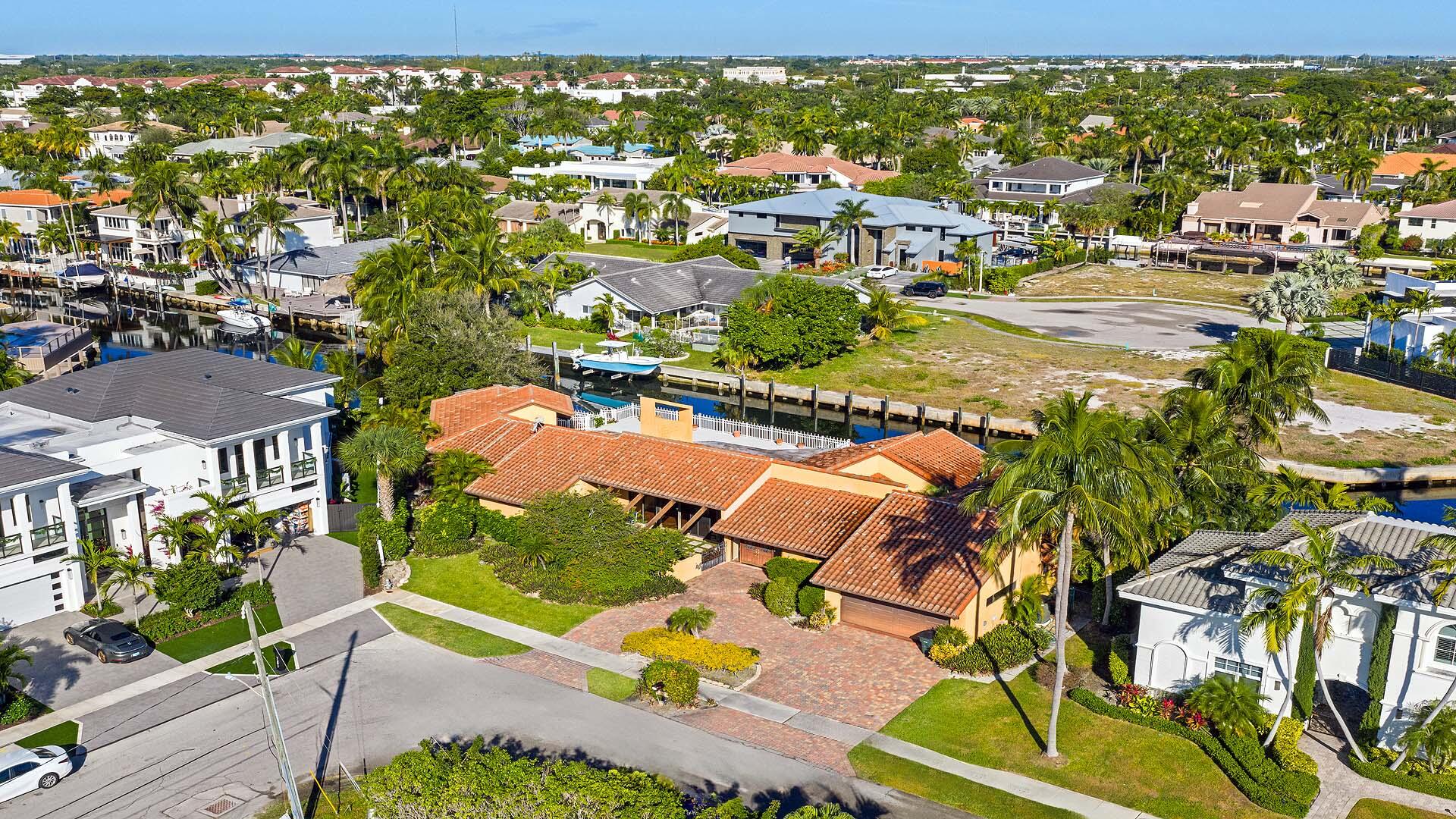 7401 Northeast Bay Cove Court Boca Raton, FL 33487 - Photo 8 of 13 an aerial view of residential houses with outdoor space