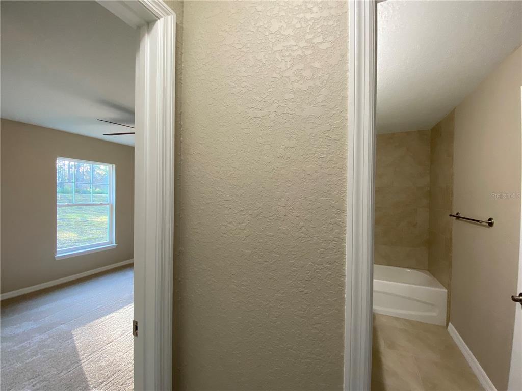 5366 Southwest 197th Terrace Dunnellon, FL 34431 - Photo 14 of 29 a bathroom with a window