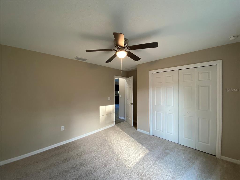 5366 Southwest 197th Terrace Dunnellon, FL 34431 - Photo 16 of 29 a view of a room with a ceiling fan and hardwood floor