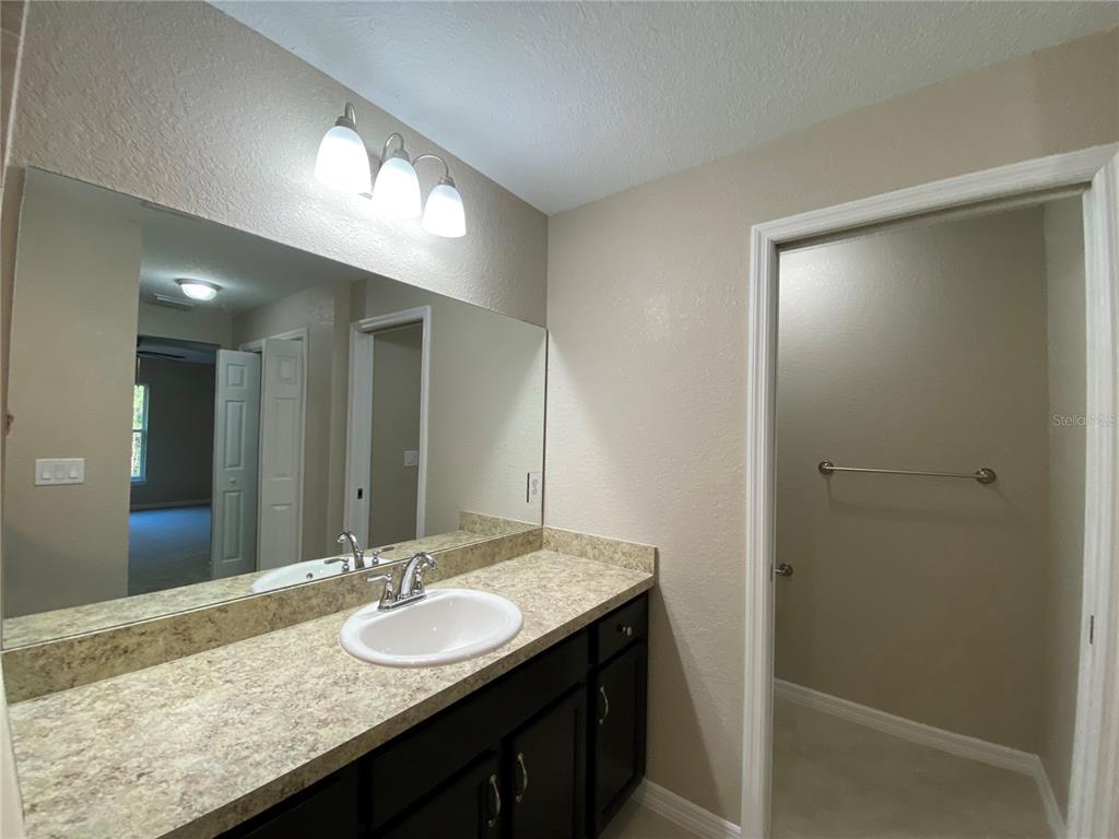 5366 Southwest 197th Terrace Dunnellon, FL 34431 - Photo 21 of 29 a bathroom with a granite countertop sink and a mirror