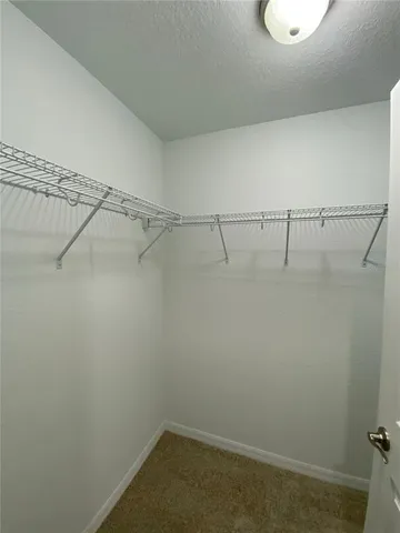 a view of a bathroom with a double vanity sink and a mirror