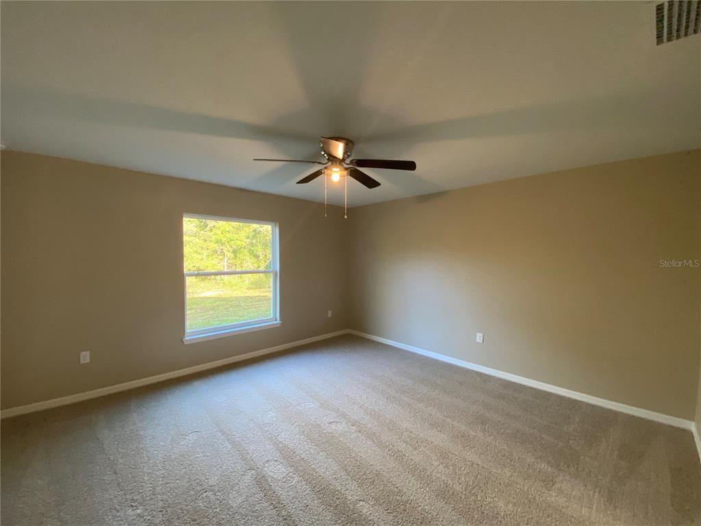 5366 Southwest 197th Terrace Dunnellon, FL 34431 - Photo 25 of 29 an empty room with a window