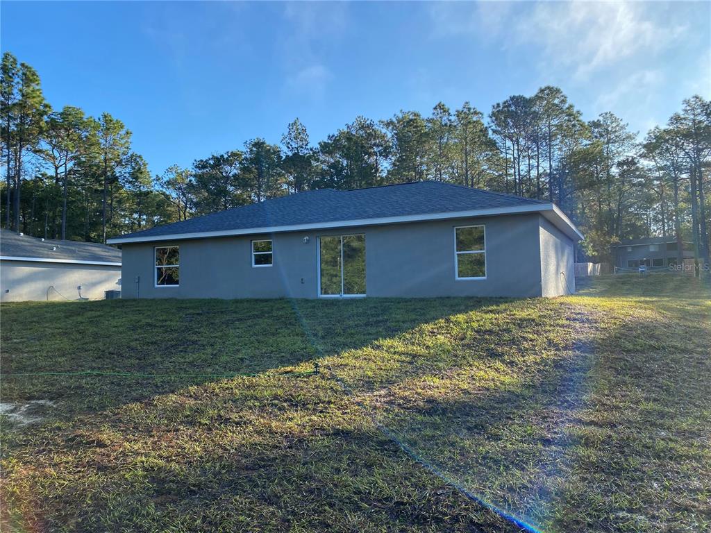 5366 Southwest 197th Terrace Dunnellon, FL 34431 - Photo 29 of 29 a view of a house with a yard