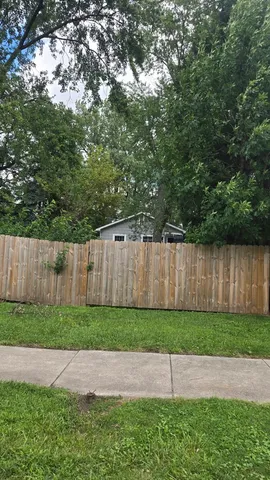 a view of backyard with green space