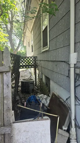 a stove top oven sitting next to a building