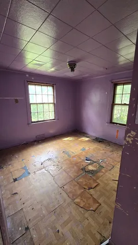 an empty room with windows