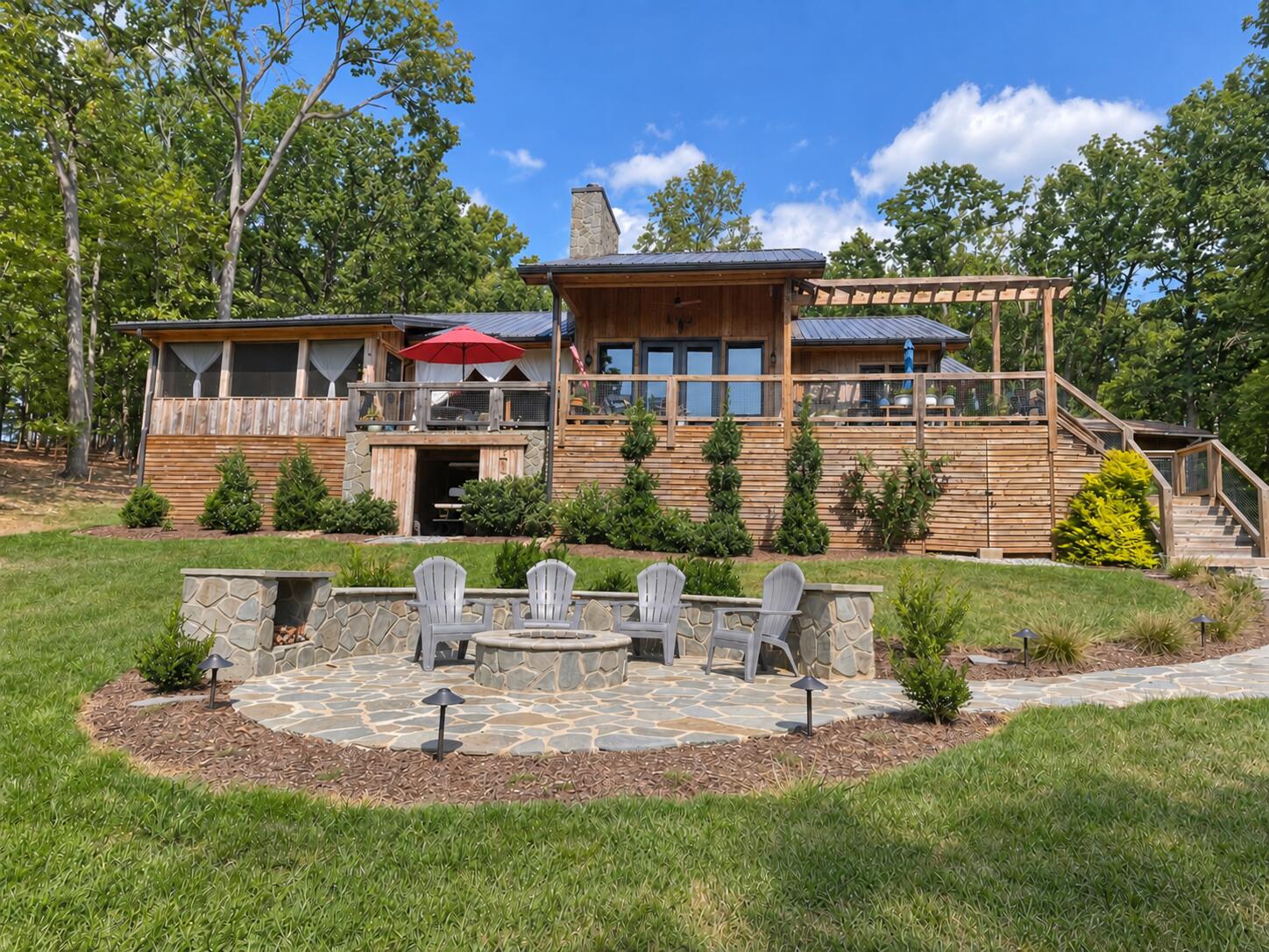 214 Saunders Point Road Huddleston, VA 24104 - Photo 1 of 9 Rear of Home with firepit