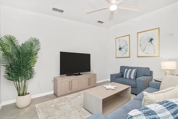 a living room with furniture and a table