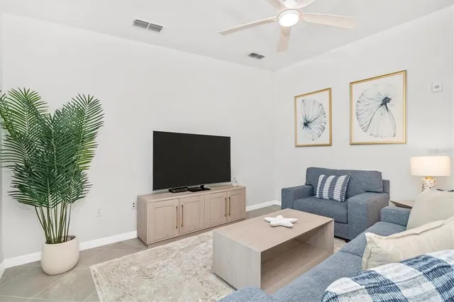 a living room with furniture and a table